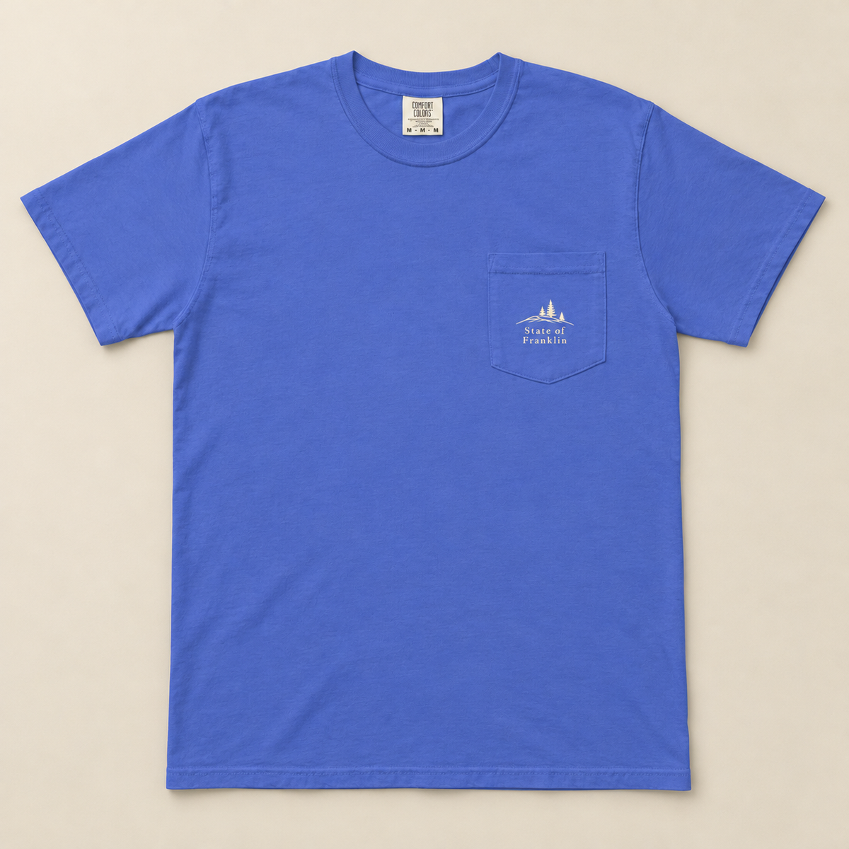 Roan Mountain Pocket Tee — Flo Blue, front view. Digital product mockup.